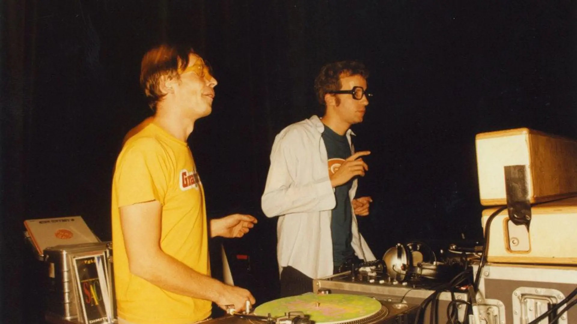 Two DJs behind the decks in the early years